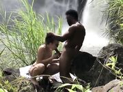 Formidable outdoor interracial sexual intercourse by the waterfall